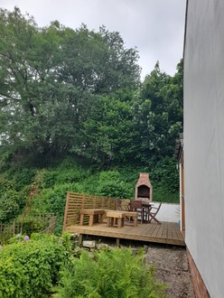 taking_down_a_dead_cherry_tree_overhanging_decking_gardens After