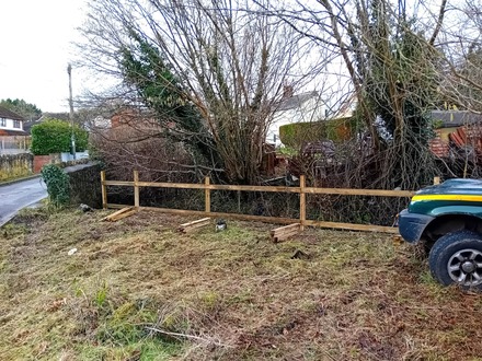 a_picket_fencing_installation_along_a_stream After